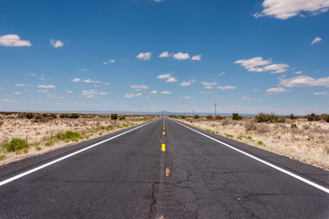 Fototapeta na wymiar Long straight road in the desert, Route 66 US
