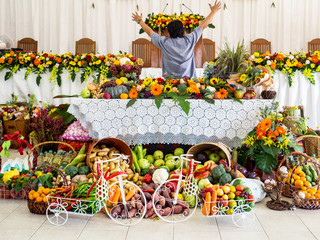 Man with Many Vegetables, fruits and flowers are Decorated for Happy Thanksgiving Day