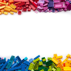 Colorful toy bricks frame with white empty space for your content
