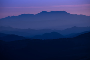Colorful sunset over the mountain hills