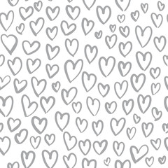 Fototapeta premium Romantic seamless pattern with cute images of hearts on a white background. The style of children's drawing.