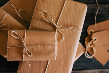 Presents wrapped in brown paper and string