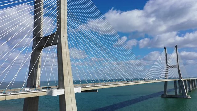 Aerial view over Vasco Da Gama Bridge in Lisbon - aerial drone footage