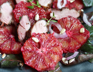 salad with red orange (blood orange), duck breast, beet top (chard), sunflower seeds, red onion....
