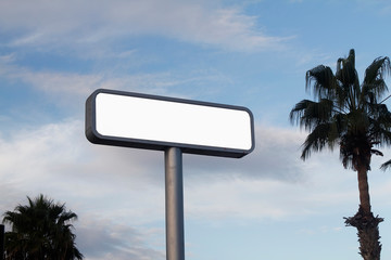 blank road sign on blue sky
