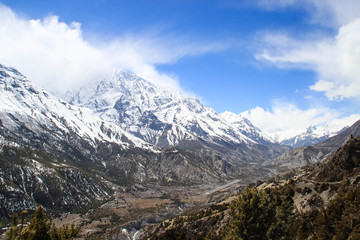 Fototapeta na wymiar Beautiful nature views of the Himalayas mountains in Nepal. The highest pedestrian pass in the world Torong La on a trekking circle around Annapurna. Snowy mountains of the Himalayas.