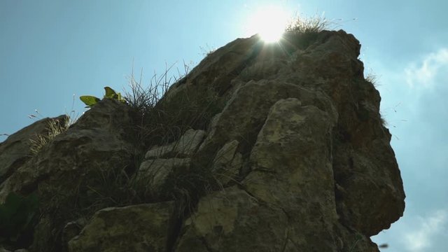 Sunray behind mountain spier