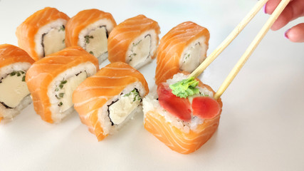 Beautiful Philadelphia Sushi Rolls Set with Salmon and Cream Cheese on white background. Sushi on white background.
