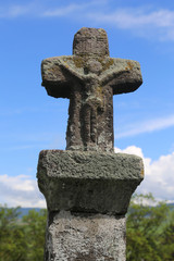 Jesus Christ sculpture on a medieval stone cross