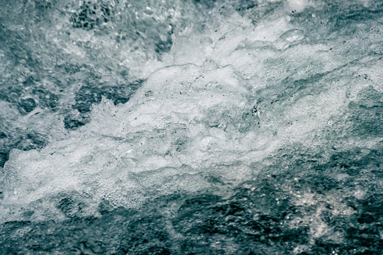 water surface of ocean, sea tide. Rapid flow of river © Koirill
