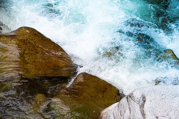 rocky bed of river, fast mountain stream with roiling stream. journey to nature in water valley