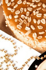 Cake with peanuts and caramel. Christmas family cake.