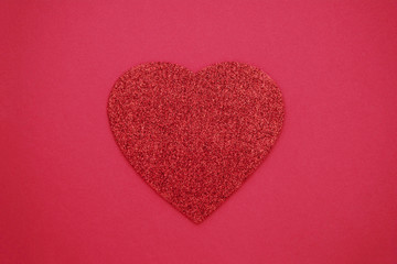 Obraz premium Love, Valentine's Day red background with glitter red heart. Flat lay.