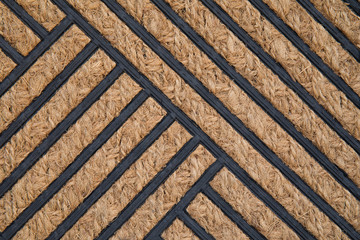 Pattern of coconut shell fiber mat with black geometry shape