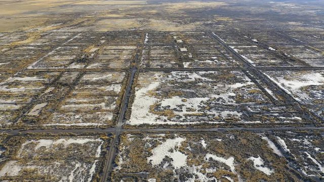 Aerial-Square grids with desert vegetation and white alkali soil are all that remains of the World War II Topaz Japanese internment camp in the Great Basin desert of Utah