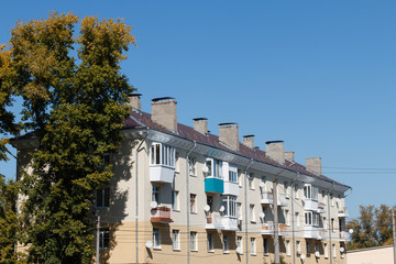 Residential house in a provincial town with a beautiful roof and chimney