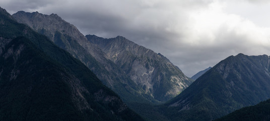 Obraz premium Dramatic Panoramic View of Canadian Mountain Landscape during a cloudy summer day. Taken near Pemberton and Lillooet, Interior BC, Canada.