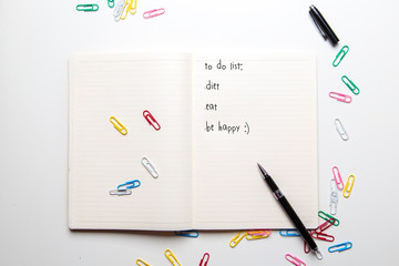 Notebook with a to do list on white table background.  planning concept