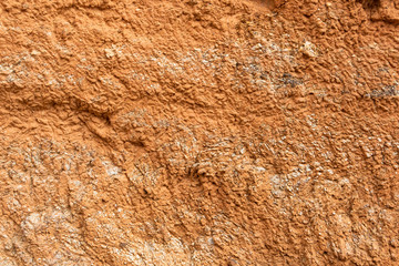 Red mountainside on hot day. Texture on wall of sandy canyon. Lack of water, drought from climate change