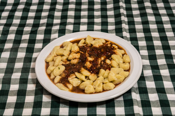 Plate of homemade gnocchi with tomato sauce