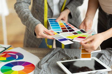 Fashion designer choosing color samples in atelier