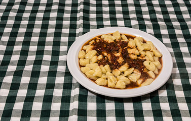 Plate of homemade gnocchi with tomato sauce