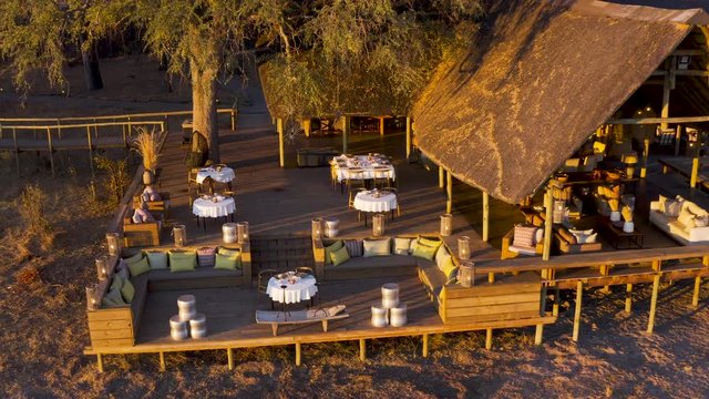 High aerial zoom out view of Sable Alley Safari Camp, Okavango Delta, Botswana