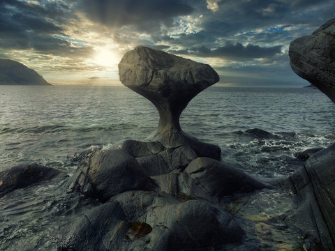 This particular sculpture in stone, shaped by the nature itself, stand in high-water mark in the villages Oppedal on the island V&aring;gs&oslash;y.After roughened this 3 meter-high stone for thousands of years 