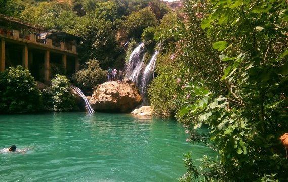 Beatiful waterfall  and small lake in algeria with green trees
