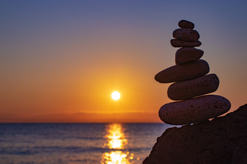 Zen concept. Sunset. The object of the stones on the beach at sunset.  Relax & Meditation. Zen stones.