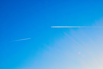 airplane flying in the sky with clouds