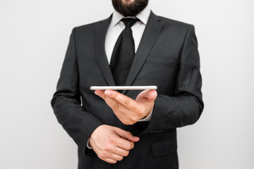Male human wear formal work suit hold smart hi tech smartphone use one hand