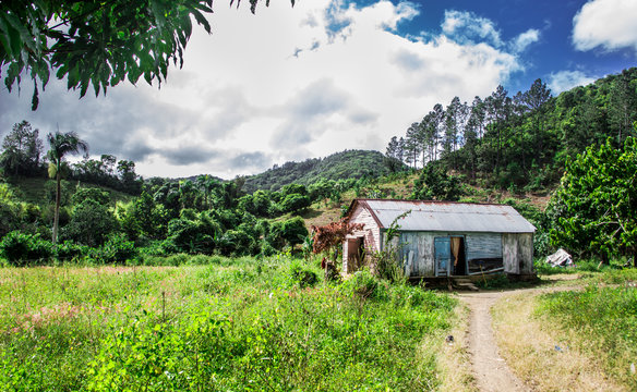dramatic image of a poor haitian dominican republic home in the mountains