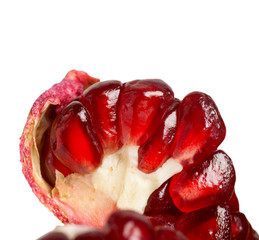 Pomegranate seeds close-up isoilrvoano on a white background