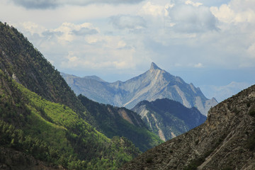 A sharp peak in the mountains. Mountain landscape. Beautiful nature in the mountains. Travel and hike.