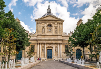 Fototapeta na wymiar Latin Quarter, Paris, historic building of University of Sorbonne, Chapel of Sorbonne, the square with fountains in front. Paris, France.