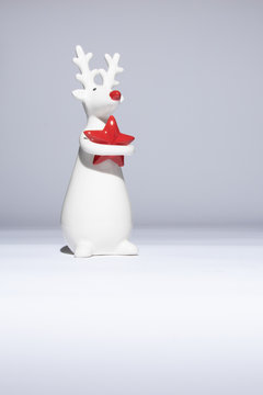 Rudolf The Red Nose Reindeer Hugging A Chrismas Star