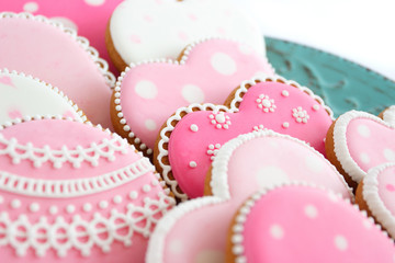 Set of pink heart shaped cookies with patterns, handmade