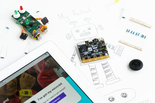 Minsk, Belarus. November, 2019. The BBC robot Micro Bit is near the robot. It can be programming on Scratch and Python. Creative. Connected. Coding. Learning, teaching easy and fun. Free space text.