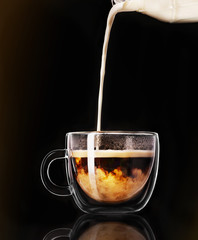 coffee in a glass dish with cream