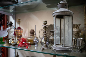 a handmade metal vintage gas lamp placed on a shelf