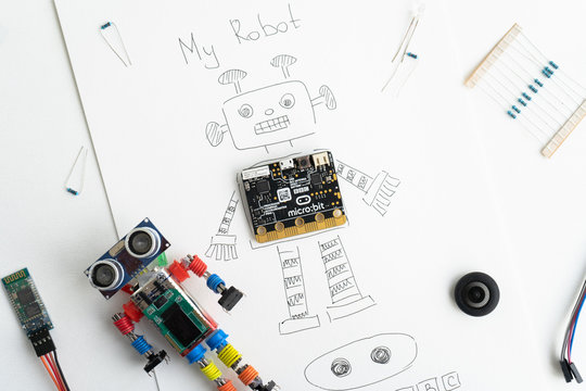 Minsk, Belarus. November, 2019. The BBC robot Micro Bit is near the robot. It can be programming on Scratch and Python. Creative. Connected. Coding. Learning, teaching easy and fun. Free space text.