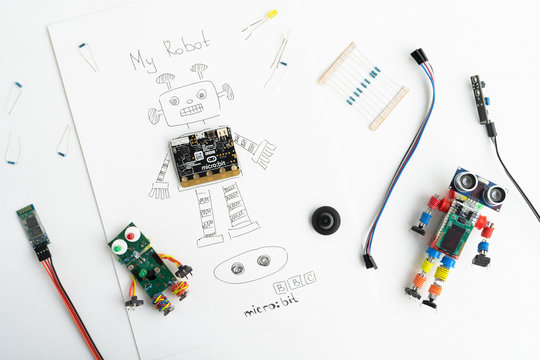 Minsk, Belarus. November, 2019. The BBC robot Micro Bit is near the robot. It can be programming on Scratch and Python. Creative. Connected. Coding. Learning, teaching easy and fun. Free space text.