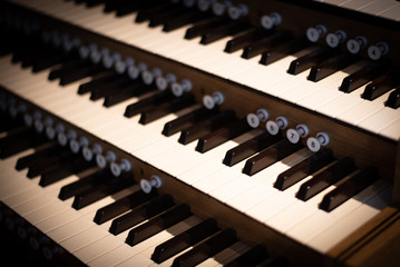 Keyboard of a traditional catholic church piano.