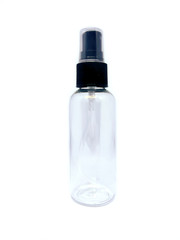 Clear, empty travel-sized spray bottle on a white background