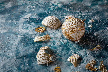 Glass christmas decoration on blue frozen background