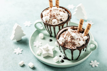 Hot chocolate festive dessert with whipped cream or ice cream