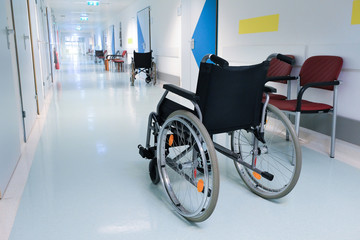 Wheelchair in the hospital hall. Hospital interior. Medical healthcare concept.