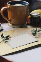 Cup of tea and leaves, postcard, winter home comfort