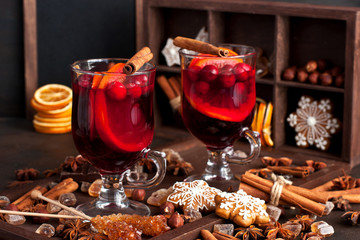 Mulled wine with slice of orange and spices